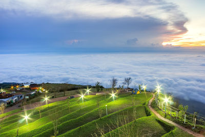 High angle view of agricultural field against sky during sunset