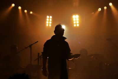 Silhouette of people at night
