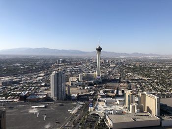 High angle view of city buildings against clear sky