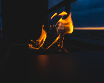 Close-up of fire burning at night