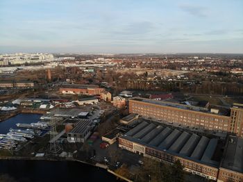 High angle view of buildings in city against sky