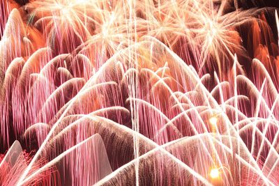 Full frame shot of illuminated firework display at night