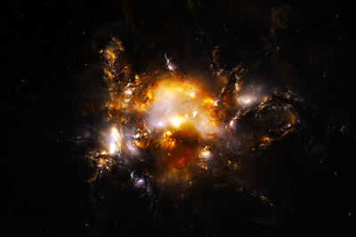 Low angle view of fireworks against sky at night
