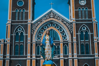 Low angle view of statue against building