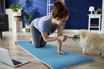 Young woman using laptop on a table
