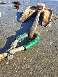 High angle view of rusty metal on road