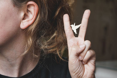 Close-up of woman with hand