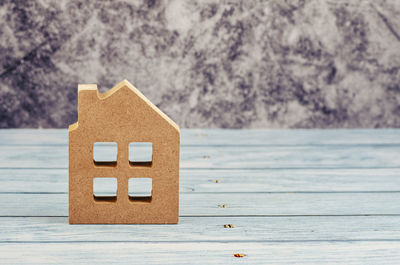 Close-up of toy on table against building