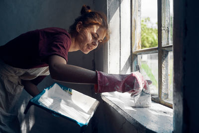 Side view of man working at home