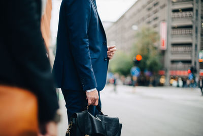 People walking on street in city