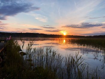 Scenic view of lake against sky during sunset