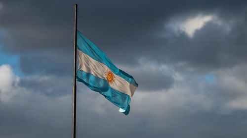 Low angle view of flag against sky