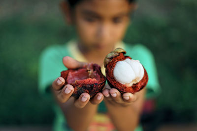 Close-up of hand holding ice cream