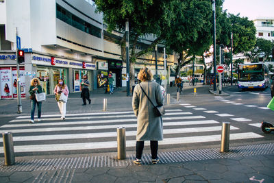 Group of people walking on road