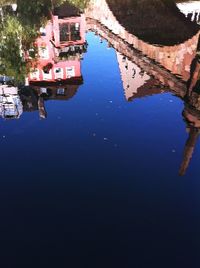 Reflection of building in puddle