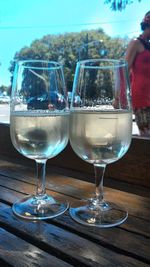 Close-up of beer in glass against sky