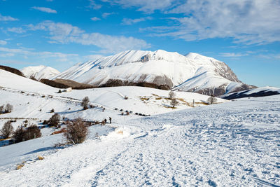 Snow covered mountain against sky in norcia, umbria italy 