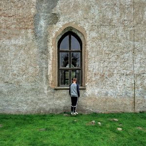 Full length of man standing in front of building