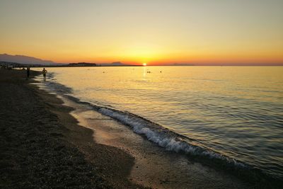 Scenic view of sea at sunset