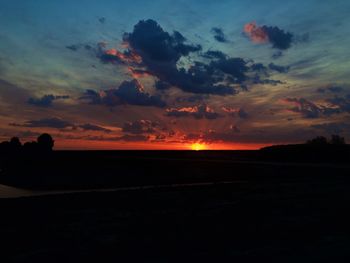 Scenic view of silhouette land against sky during sunset