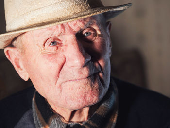 Close-up portrait of man wearing hat