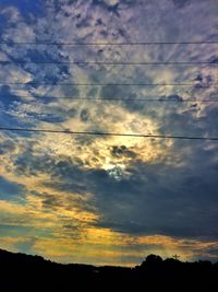 Silhouette of landscape against sunset