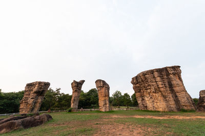 Old ruins on field against clear sky