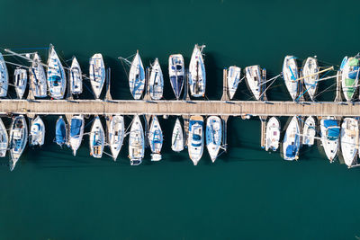 High angle view of boats moored at harbor