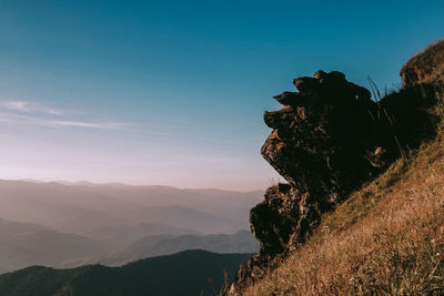 Scenic view of silhouette mountains against sky