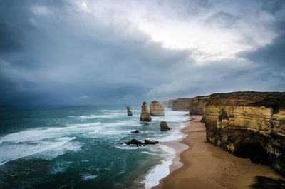 View of beach against cloudy sky