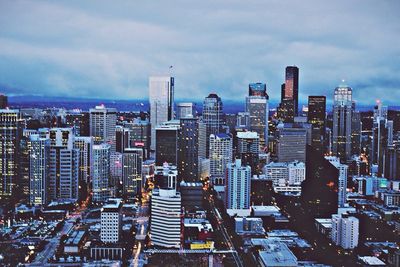 City skyline against cloudy sky