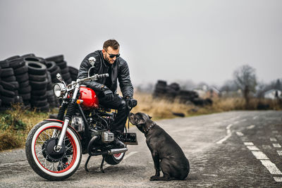 Man riding motorcycle on road