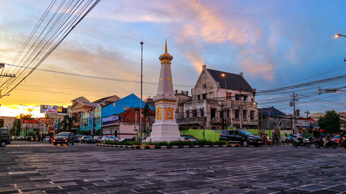 Street amidst buildings in city against sky