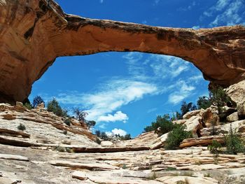 Low angle view of rock formation against sky