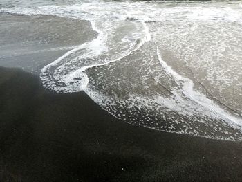 High angle view of surf on beach