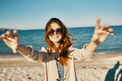 Portrait of smiling young woman on beach