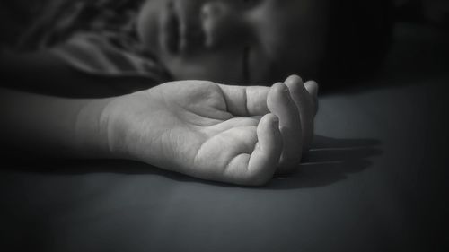 Close-up of baby holding hands