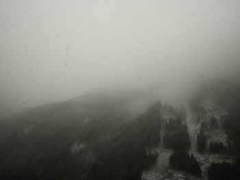 Scenic view of mountains against sky during rainy season