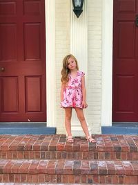 Full length of girl standing on steps