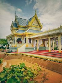 Temple outside building against sky