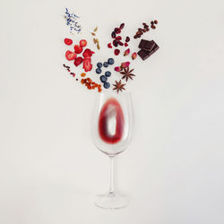 Still life composition with wine glass and possible flavors of red wine. flat lay composition