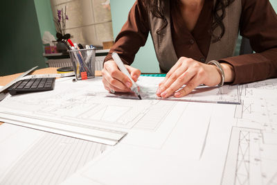 Midsection of business colleagues working at office