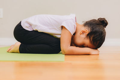 Young woman lying on floor