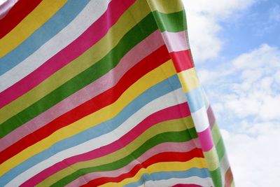 Low angle view of multi colored towel against sky