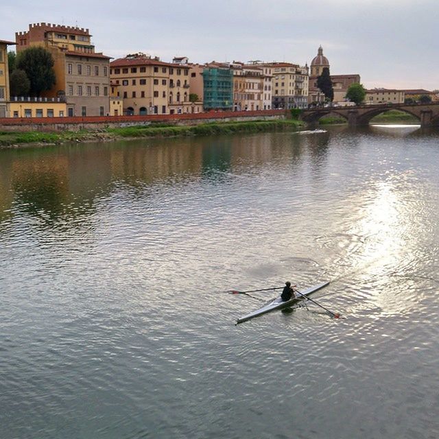 water, architecture, building exterior, built structure, waterfront, nautical vessel, transportation, mode of transport, boat, river, men, city, reflection, rippled, bird, travel, leisure activity, lake