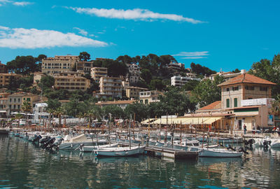 Boats moored at harbor