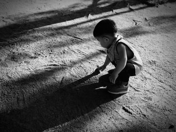 High angle view of girl on shadow