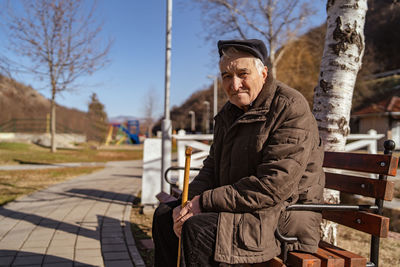 Senior man sitting on bench