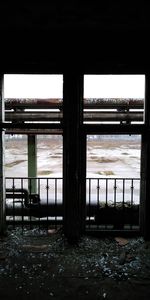 Scenic view of sea against sky seen through window