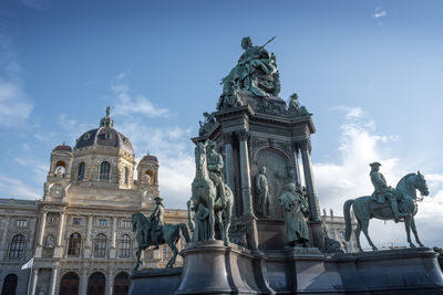 Low angle view of statue against historic building